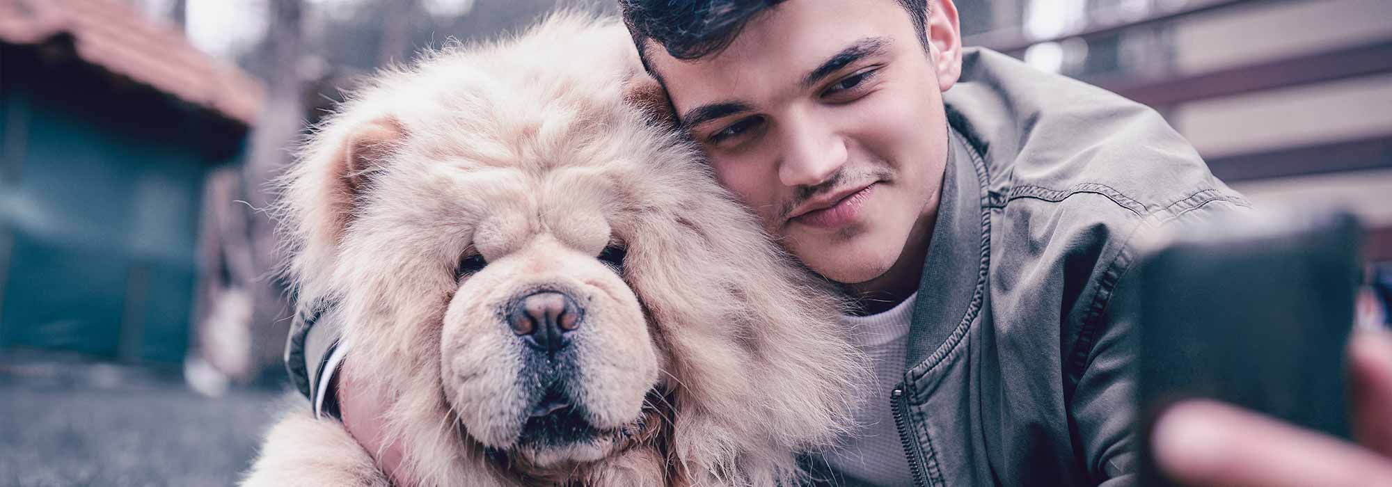 Young Man and Dog Taking Selfie